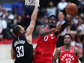 Terence Davis of Toronto Raptors drives to the basket against Ryan Anderson #33 of Houston Rockets during the preseason game between Houston Rockets and Toronto Raptors at Saitama Super Arena on October 8, 2019 in Saitama, Japan.