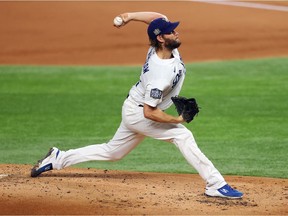 Clayton Kershaw #22 of the Los Angeles Dodgers pitches against the Tampa Bay Rays during the second inning in Game One of the 2020 MLB World Series at Globe Life Park on October 20, 2020 in Arlington, Texas.