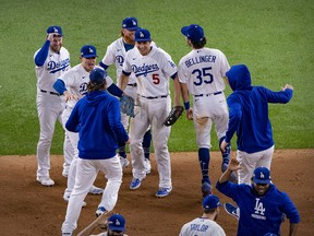 The Los Angeles Dodgers celebrate defeating the Atlanta Braves in game seven of the 2020 NLCS at Globe Life Field.