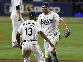 Tampa Bay Rays center fielder Manuel Margot and shortstop Willy Adames celebrate the win over the Houston Astros that takes the team to its second World Series appearance.