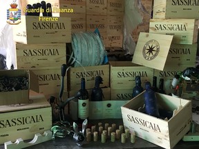 Bottles of counterfeit Sassicaia wine, a variety considered among the finest in the world, are seen in an undisclosed location near Milan.