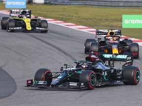 Mercedes' driver Lewis Hamilton races ahead of Red Bull's Max Verstappen and Renault's Daniel Ricciardo during the Eifel Grand Prix at the Nuerburgring circuit in Nuerburg on October 11, 2020.