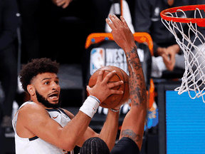 Jamal Murray of the Denver Nuggets drives to the basket against Anthony Davis of the Los Angeles Lakers during the NBA Western Conference Finals, September 26, 2020.