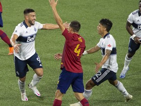 Oct 10, 2020; Portland, Oregon, USA; Vancouver Whitecaps forward Lucas Cavallini (9) celebrates with teammates after scoring a goal against Real Salt Lake at in the second half Providence Park. The Vancouver Whitecaps won. Mandatory Credit: Troy Wayrynen-USA TODAY Sports