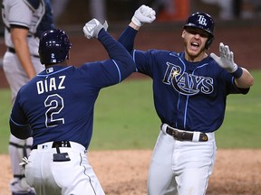 Tampa Bay Rays first baseman Michael Brosseau (43) celebrates with designated hitter Yandy Diaz (2) after hitting a home run against the New York Yankees at Petco Park.