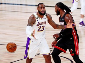 Los Angeles Lakers forward LeBron James (23) reacts after a call during the fourth quarter of game three of the 2020 NBA Finals against the Miami Heat at AdventHealth Arena. The Miami Heat won 115-103.