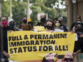 People march towards Deputy Prime Minister Chrystia Freeland's office in Toronto on Sept. 12, 2020, in a rally led by current and former international students calling for changes to immigration rules during the ongoing COVID-19 pandemic.