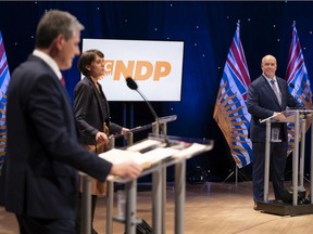 NDP Leader John Horgan, right to left, Green leader Sonia Furstenau and Liberal leader Andrew Wilkinson prepare for a debate at the Chan Centre in Vancouver, B.C., Tuesday, October 13, 2020.