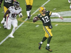 Green Bay Packers quarterback Aaron Rodgers (12) throws a pass against the Atlanta Falcons in the second quarter at Lambeau Field. Mandatory Credit: Benny Sieu-USA TODAY Sports