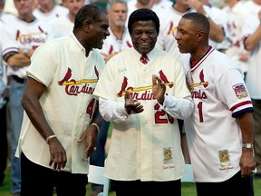 Cardinals fans have lost Bob Gibson (left) and Lou Brock (centre) in the past month. They're pictured with fellow St. Louis Hall of Famer Ozzie Smith at a ceremony commemorating the last regular season game at Busch Stadium in 2005.