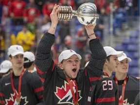 Defenceman Bowen Byram of the Vancouver Giants celebrates with the World Junior Hockey Championship trophy after Canada defeated Russia in the gold-medal game on Jan. 5, 2020 in Ostrava, Czech Republic.
