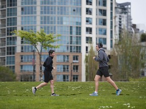 Runners social distancing  at David Lam Park in Vancouver