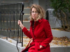 Katie Lewis says she was attacked from behind by a man with a metal pipe on Saturday. Lewis, who received 13 stitches to close the wound, is shown here outside her Strathcona home.