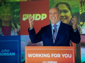 John Horgan celebrates his election victory at the Pinnacle Hotel Harbourfront in Vancouver on Saturday night. Horgan’s government accepts some environmental risks to support a huge economic investment in B.C. like LNG Canada, but balks at the same risks to support economic activity in other provinces through the Trans Mountain pipeline expansion, says former NPD MP Erin Weir.