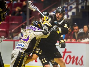 Mike Mallory of the Vancouver Warriors, pushed by Brandon Clelland of the San Diego Seals last December after making a pass at Rogers Arena. The Warriors hope to launch their 2021 National Lacrosse League season in early April.