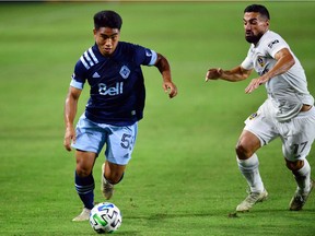 Vancouver Whitecaps academy member Michael Baldisimo, here moving the ball against the L.A. Galaxy during a 2020 Major League Soccer game, broke into the first team last season.