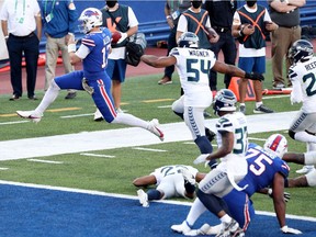 Josh Allen of the Buffalo Bills leaps to score a touchdown during the second half against the Seattle Seahawks at Bills Stadium on Nov. 8, 2020 in Orchard Park, New York.