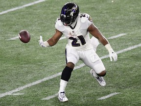Baltimore Ravens running back Mark Ingram fumbles the ball during an NFL game against the New England Patriots on Nov. 15, 2020 at Gillette Stadium in Foxborough, Mass.