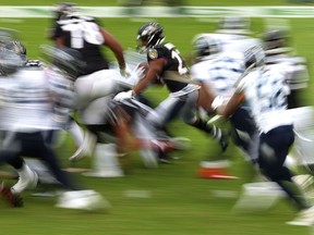 Baltimore Ravens running back Mark Ingram rushes against the Tennessee Titans during their Nov. 22, 2020 National Football League game at M&T Bank Stadium in Baltimore, Md.