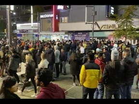 Halloween partiers are seen filling Granville Street in downtown Vancouver on Halloween