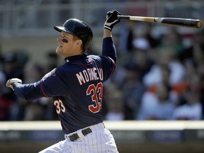 Justin Morneau will lend his voice and support to a to a  #33 of the Minnesota Twins singles against the Detroit Tigers during the sixth inning of the game on April 4, 2013 at Target Field in Minneapolis, Minnesota. The Twins defeated the Tigers 8-2.