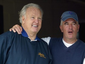 Former Heisman trophy winner Paul Hornung talks with former Kentucky Derby-winning trainer Nick Zito during morning workouts for the 129th Kentucky Derby on April 30, 2003 at Churchill Downs in Louisville, Kentucky.