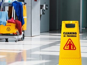 Janitorial and mop bucket on cleaning