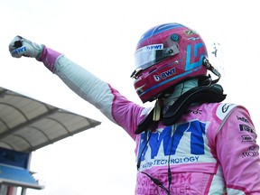 Pole position qualifier Lance Stroll of Racing Point celebrates in parc ferme ahead of the F1 Grand Prix of Turkey at Intercity Istanbul Park on November 14, 2020 in Istanbul.