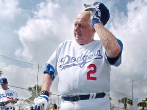 Tommy Lasorda of the Los Angeles Dodgers readjusts his cap during a practice session at their spring training centre in Vero Beach, Fla., in February 2005.