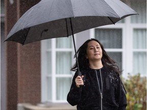 Meng Wanzhou, chief financial officer of Huawei, leaves her home to attend a hearing at B.C. Supreme Court, in Vancouver, on Tuesday, November 24, 2020.