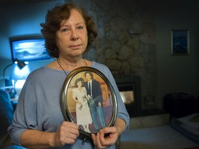 Bronwyn James with wedding photo of her and husband, Doug Fung. Eric Hamber teacher Fung died of COVID-19 in October.