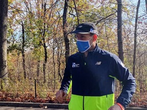 Thomas Panek, a blind runner and CEO of Guiding Eyes for the Blind, gets ready for a 5K run in Central Park where he will use Google's 'Guideline' app instead of help from a human or guide dog, in New York on Nov. 19, 2020.