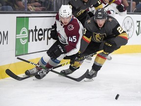 Bowen Byram of the Colorado Avalanche, left, was having a great junior camp in Red Deer when the Canadian squad was forced into quarantine following two positive cases of COVID-19.