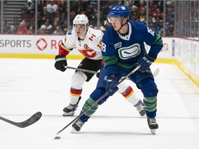Jake Virtanen #18 of the Vancouver Canucks skates with the puck in NHL action against the Calgary Flames at Rogers Arena on February 8, 2020 in Vancouver, Canada. The Canucks will be back playing at Rogers Arena when the NHL kicks off its new season in 2021.