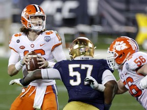 Clemson University quarterback Trevor Lawrence looks to pass in the fourth quarter against the Notre Dame Fighting Irish in their ACC Championship game at Bank of America Stadium in Charlotte, N.C., on Dec. 19, 2020.