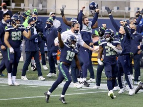 The Seattle Seahawks celebrate a touchdown against the Los Angeles Rams during the fourth quarter at Lumen Field on December 27, 2020 in Seattle, Washington.
