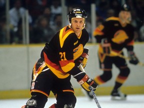 Doug Smith in action for the Vancouver Canucks during a 1988-89 NHL season game in East Rutherford, N.J., against the New Jersey Devils. Smith played 40 games for the Canucks over two seasons.