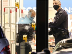 The scene of Sunday night's fatal shooting outside the Shoppers Drug Mart at 152nd Street and Fraser Highway in Surrey.