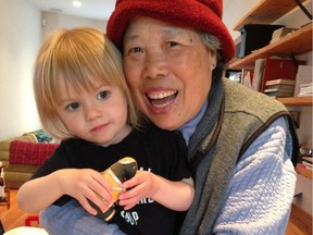 Anhi Sy, with one of her many friends in Vancouver's Strathcona neighbourhood. Sy, who everybody knows as Annie, is a bottle-picker who is beloved by local residents for her cheery disposition. She's fighting cancer and a GoFundMe campaign has been launched to help her.