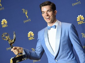 John Mulaney poses with his Emmy for outstanding writing for a variety special during the 70th Emmy Awards at the Microsoft Theatre in Los Angeles on September 17, 2018.