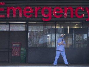 A health-care worker is seen outside the emergency department of Vancouver General Hospital.