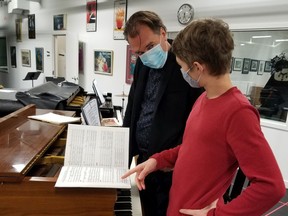 Conductor Leslie Dala and his son Andreas rehearse for Amahl and the Night Visitors.