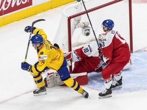 Vancouver Canucks prospect Arvid Costmar celebrates his first-period goal for Sweden against the Czech Republic at the 2021 IIHF World Junior Championship in Edmonton.