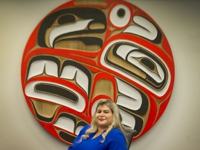 Celeste Haldane, chief commissioner of the B.C. Treaty Commission, pictured in front row, far left, on the office’s Christmas card, is “super excited” about raising funds for The Province Empty Stocking Fund. She challenges other offices to raise their own funds for the Christmas charity.