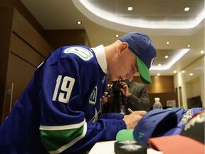Vasili Podkolzin signs autographs after being selected tenth overall by the Vancouver Canucks during the first round of the 2019 NHL Draft at Rogers Arena on June 21, 2019 in Vancouver, Canada.