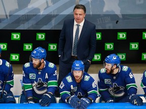 Head Coach Travis Green of the Vancouver Canucks looks on from the bench in Game Two of the Western Conference Qualification Round against the Minnesota Wild prior to the 2020 NHL Stanley Cup Playoffs at Rogers Place on August 4, 2020 in Edmonton, Alberta.