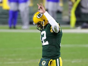 Aaron Rodgers of the Green Bay Packers reacts in the fourth quarter against the Los Angeles Rams during the NFC Divisional Playoff game at Lambeau Field on Jan. 16, 2021.