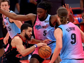 Fred VanVleet of the Toronto Raptors drives on Precious Achiuwa of the Miami Heat during a game at Amalie Arena on Wednesday.