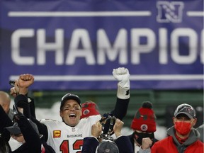 Tom Brady #12 of the Tampa Bay Buccaneers celebrates with teammates after their 31 to 26 win over the Green Bay Packers during the NFC Championship game at Lambeau Field on January 24, 2021 in Green Bay, Wisconsin.