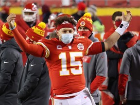 Patrick Mahomes #15 of the Kansas City Chiefs celebrates on the sideline in the fourth quarter against the Buffalo Bills during the AFC Championship game at Arrowhead Stadium on January 24, 2021 in Kansas City, Missouri.